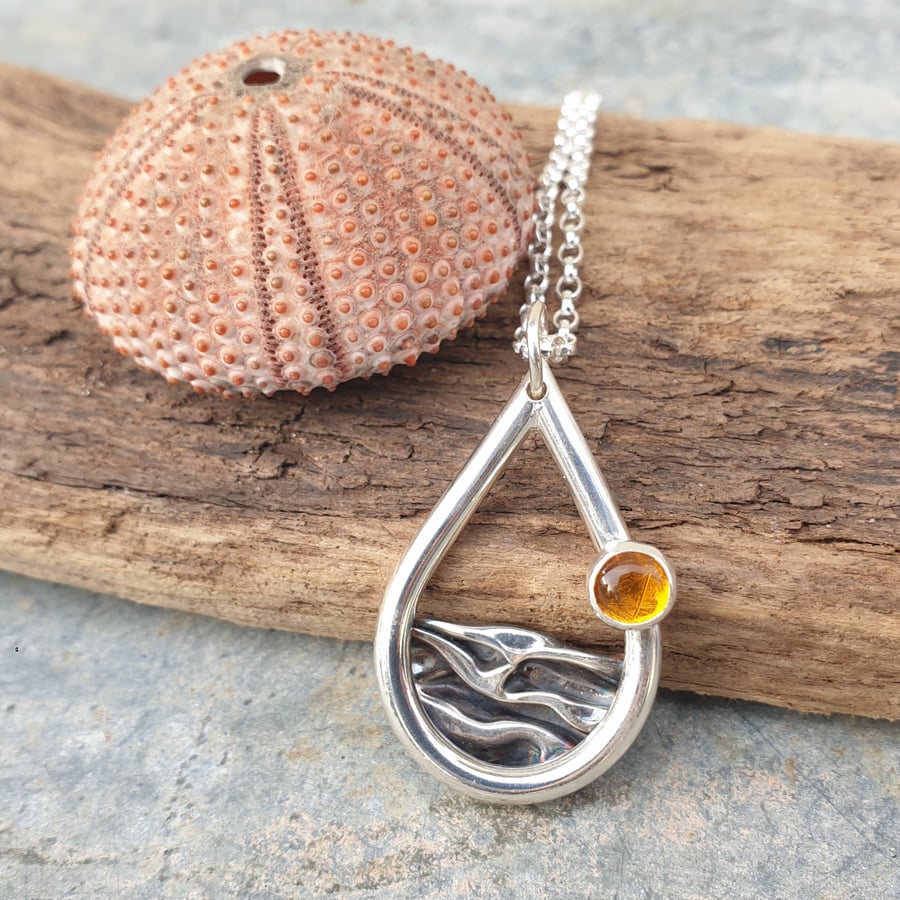Silver sea mountains hills pendant with amber sun