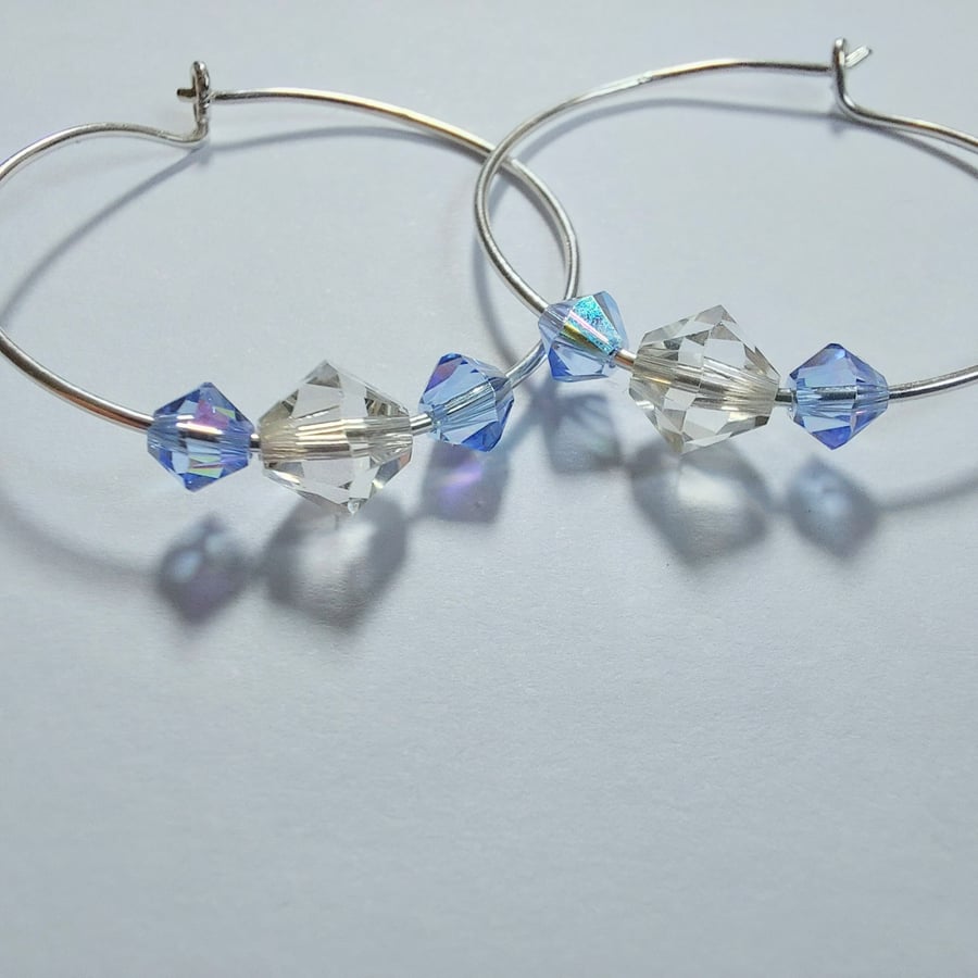 Silver hoop earrings with Swarovski beads in clear crystal and sky blue