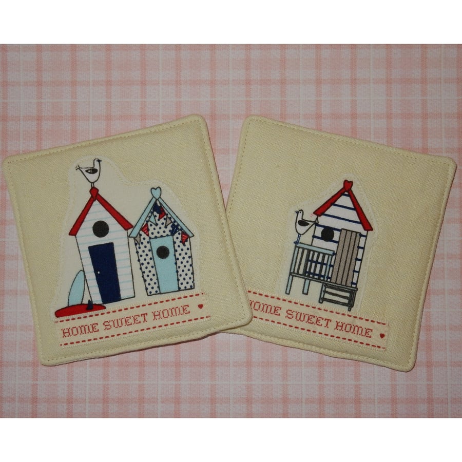 Coasters pair beach huts and home sweet home