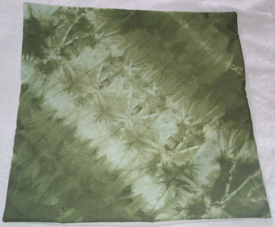 Olive green tie dye cushion, feathers and flowers