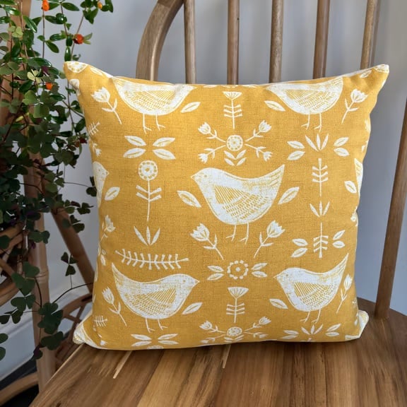 Cushion cover with a Scandi bird and flower print in ochre, 36cm x 36cm