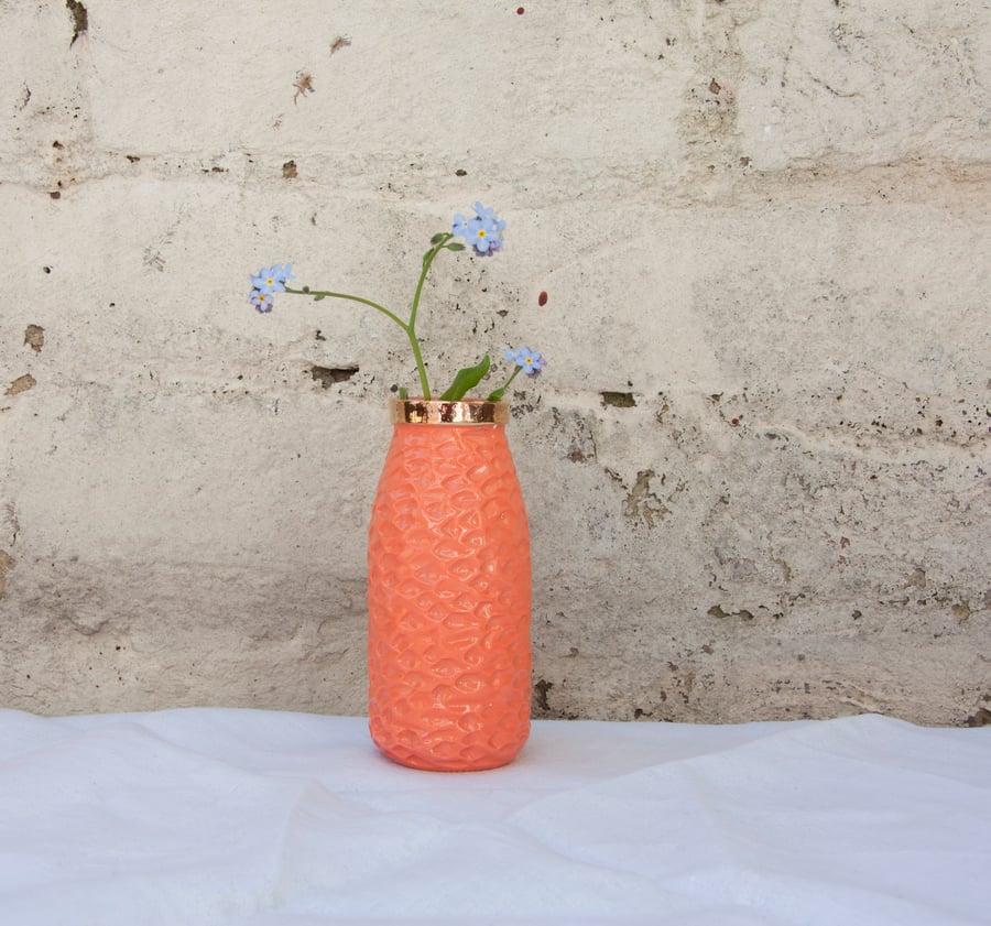 Orange milk bottle vase