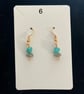 Beautiful dangling earrings with green and grey stones 