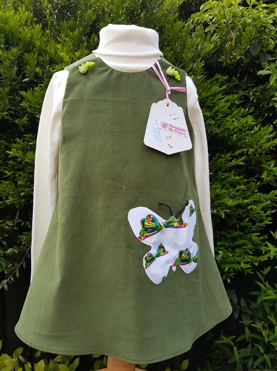 Age: 2-3y. Olive green baby needlecord pinafore dress. 