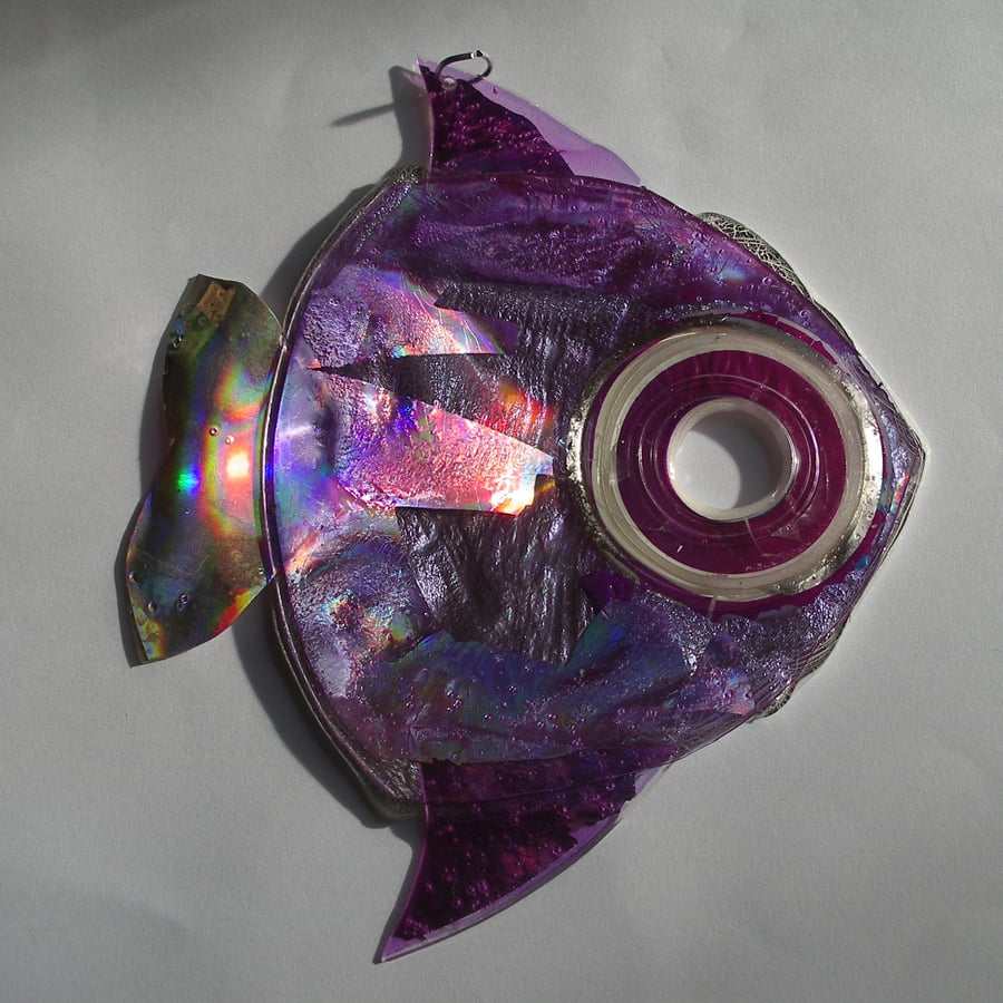 Metallic purple hanging fish ornament.
