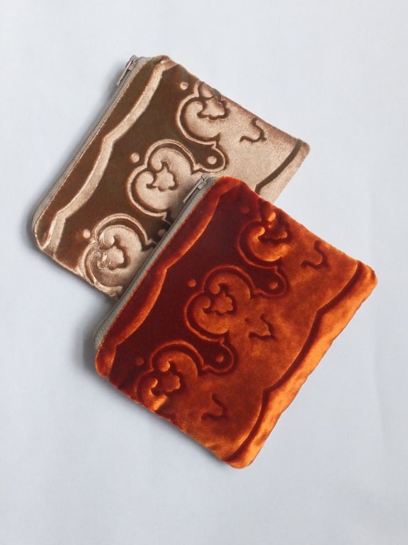 Orange small pouch purse with embossed velvet & linen border design and zip top.