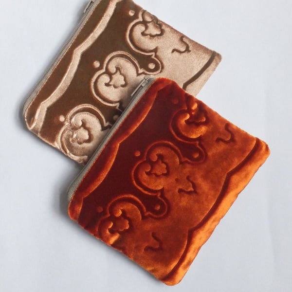 Orange small pouch purse with embossed velvet & linen border design and zip top.