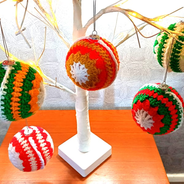 Christmas glass baubles, with crocheted wool covering