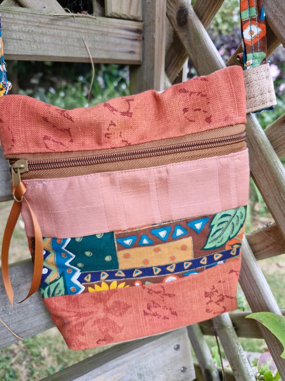 Handy striped crossbody bag with front zip