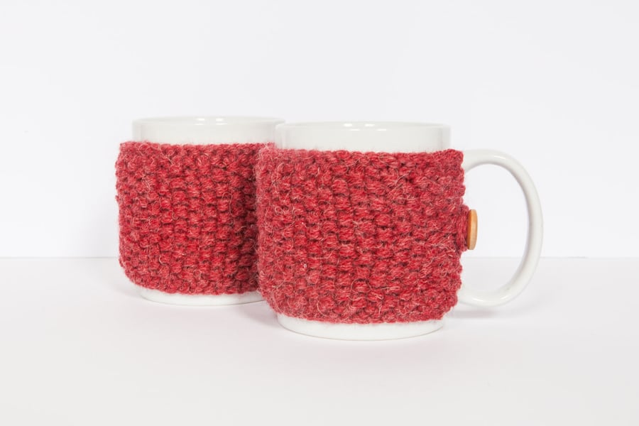 Pair of knitted mug cosies, cup cosy, coffee cosy in red. Coffee mug cosy