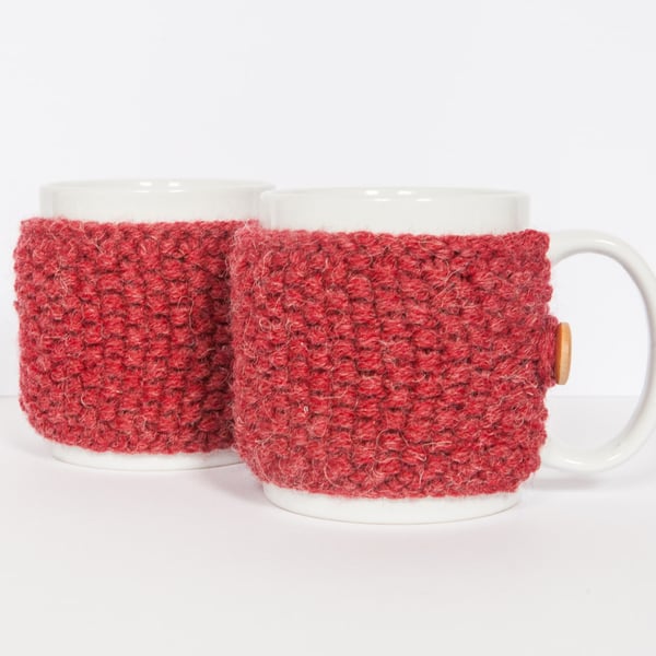 Pair of knitted mug cosies, cup cosy, coffee cosy in red. Coffee mug cosy