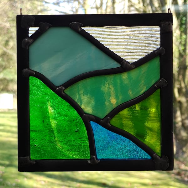SOLD Summertime green mountain landscape stained glass scene panel.