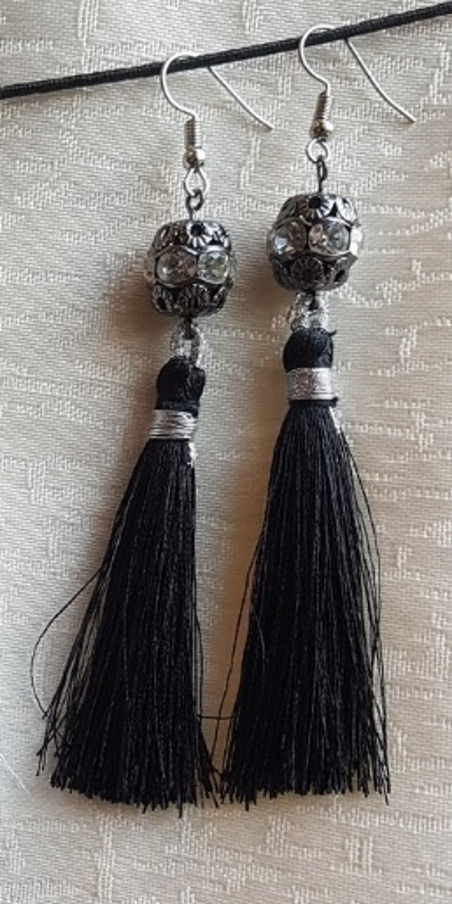 Black Tassel Earrings with dark tone crystal studded bead.