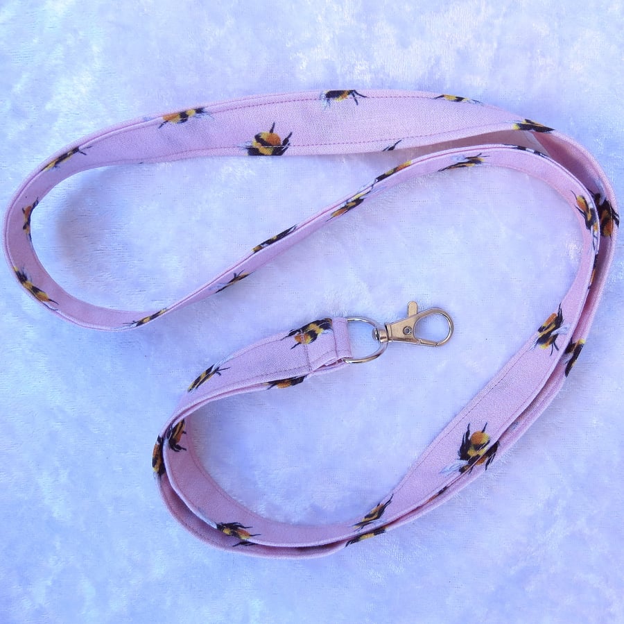 Cotton lanyard.  With swivel lobster clip. 19.5 inches in length.  Bees.