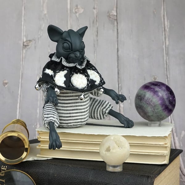 'Orion', a black porcelain and textile mouse doll.