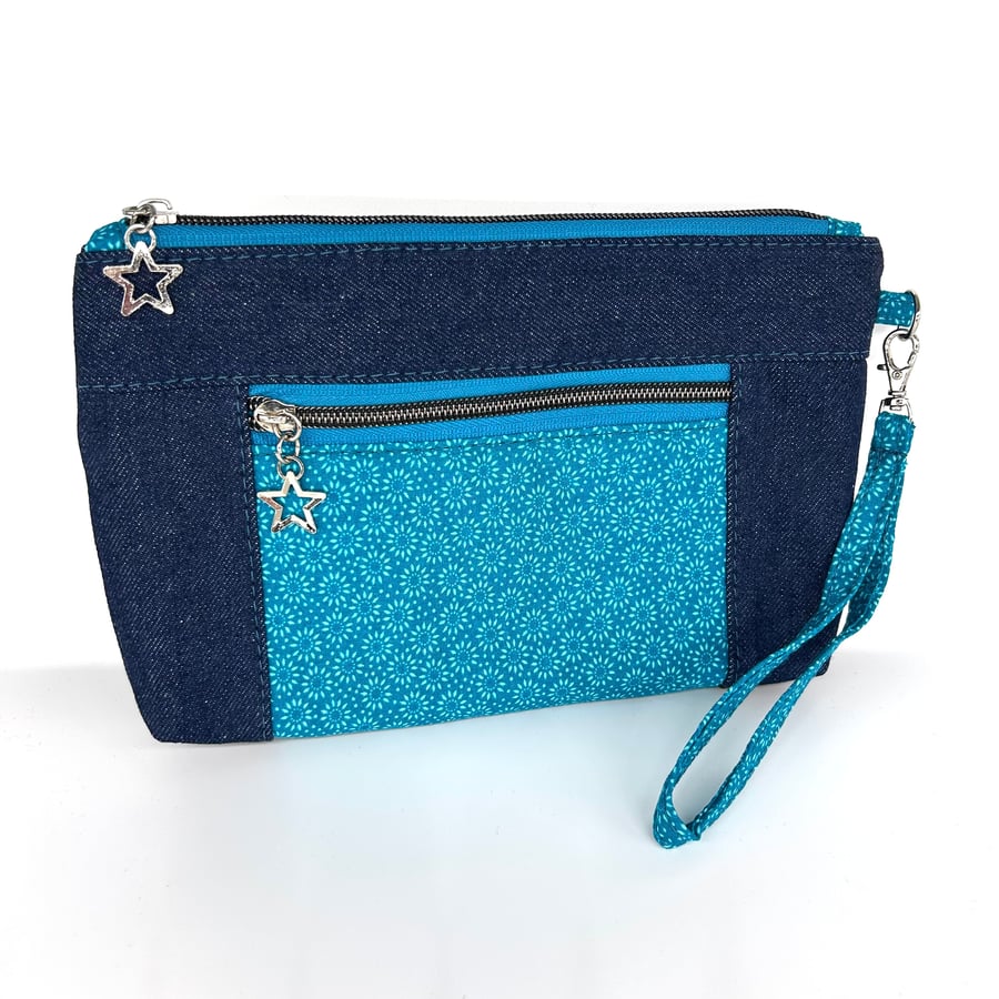 Blue denim and blue ditsy flowe wristlet zipper pouch. Blu print accent pocket. 