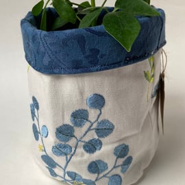 Large fabric basket: plant pot, storage. Floral embroidered and blue.