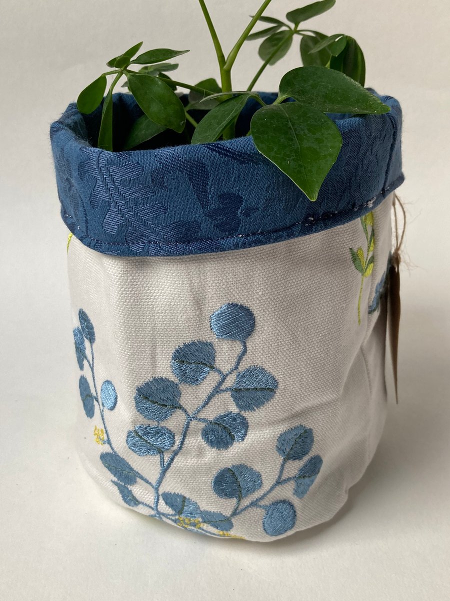 Large fabric basket: plant pot, storage. Floral embroidered and blue.