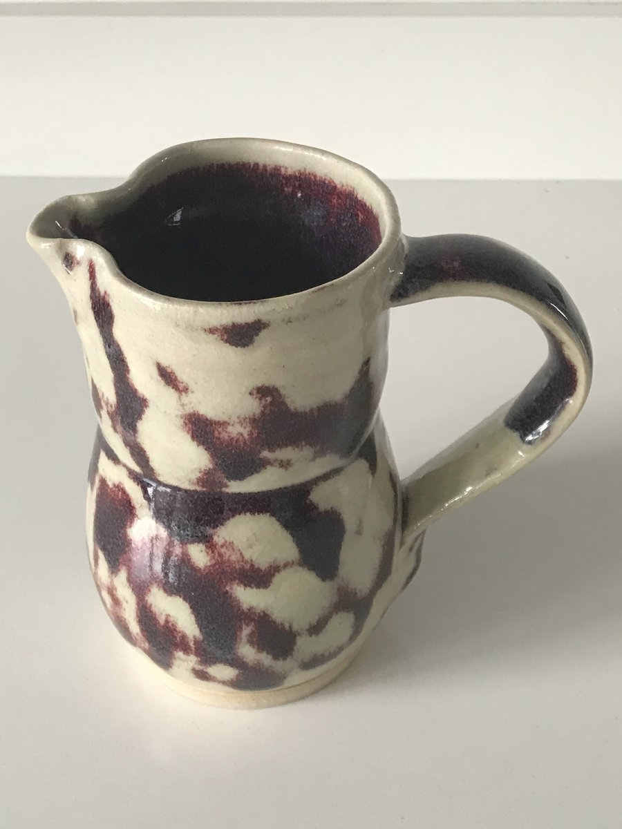 Stoneware pottery jug, white, purple glaze