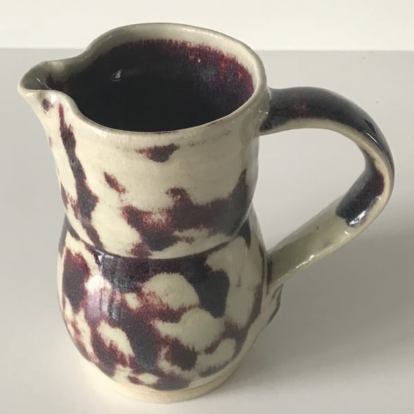 Stoneware pottery jug, white, purple glaze