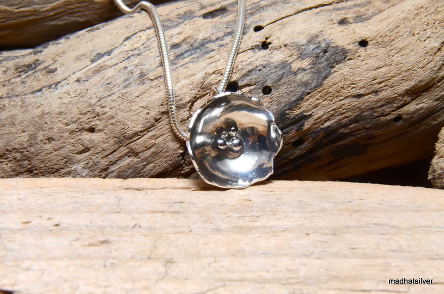 Hammered silver flower pendant