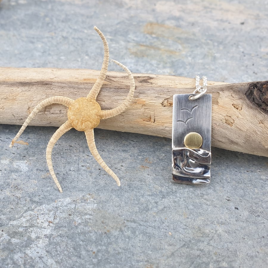 Silver beach, sea coast pendant, with brass sun and seagulls