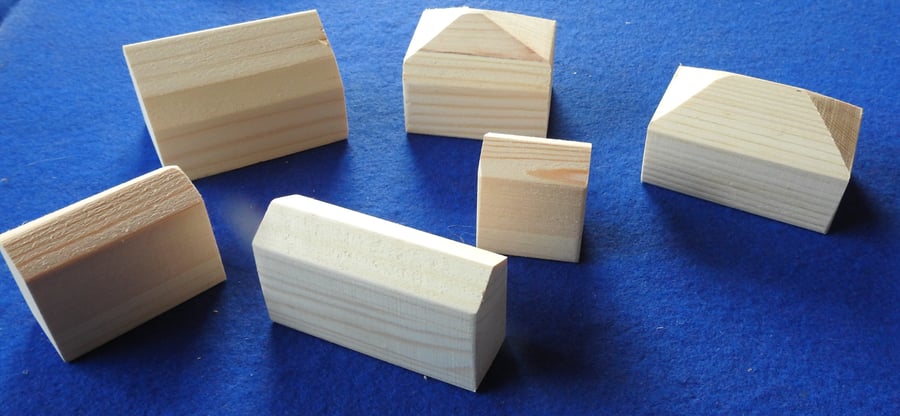 Six little unpainted wooden cottages for you to paint & decorate with children