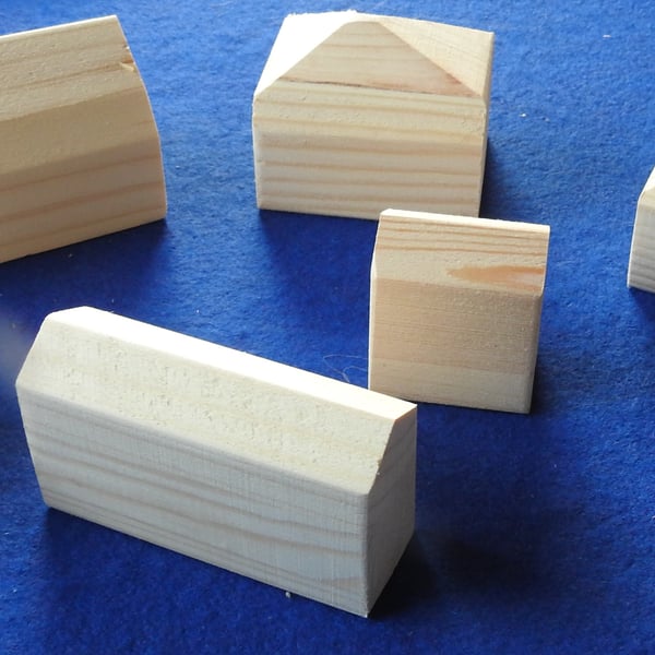 Six little unpainted wooden cottages for you to paint & decorate with children