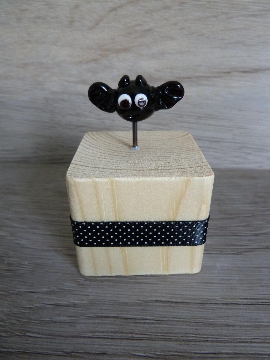 glass bat on wooden block