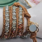 Pale blue and bronze leather triple wrap bracelet boho style with flower clasp