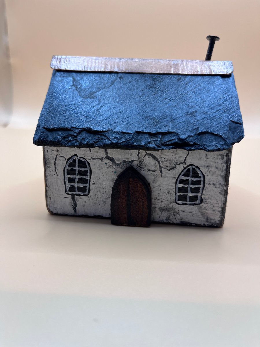 Slate roofed white chapel 