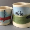 2x Ceramic jug. Cyclist. Milk Jug. Pourer. Bike. Cream jug. Gravy. Sauce.