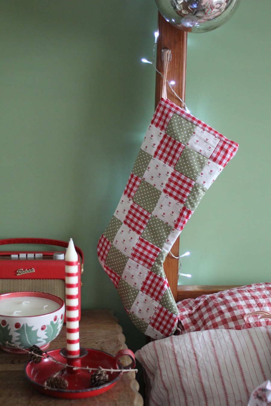 Patchwork Christmas stocking in shades of red, green and cream. Postage included