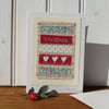 Hand-stitched Christmas card with three little hearts and pretty fabrics