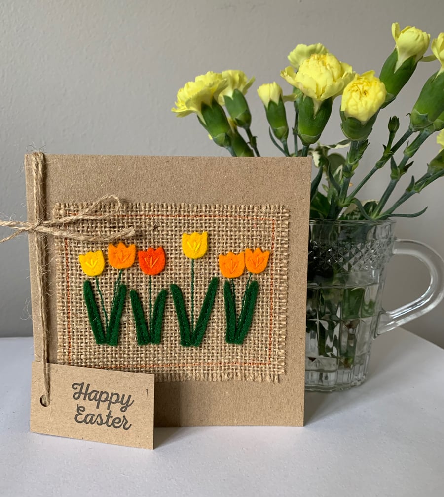 Easter greeting card with row of orange and yellow flowers. Handmade. Wool felt.