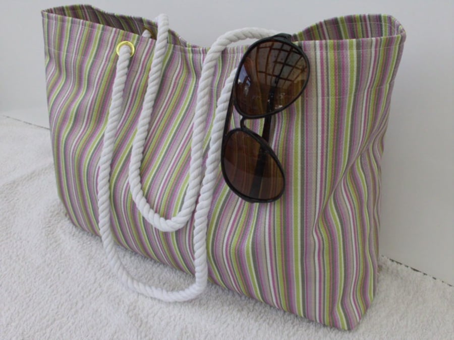 Tote beach bag in multi coloured stripes with rope handles