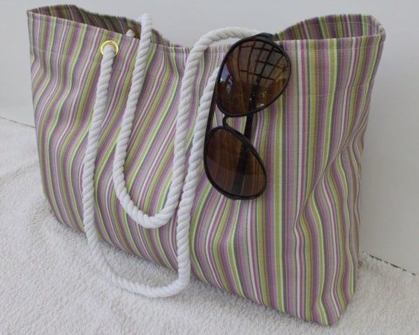 Tote beach bag in multi coloured stripes with rope handles