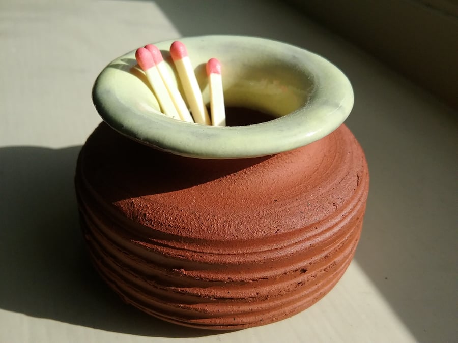 Handmade handthrown ceramic terracotta glazed match striker pot.