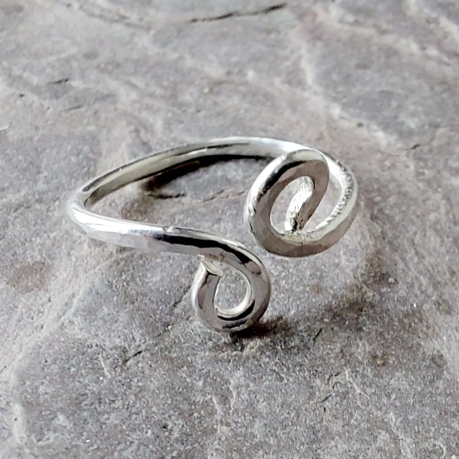 Simple adjustable sterling silver ring, hammered, with scrolls