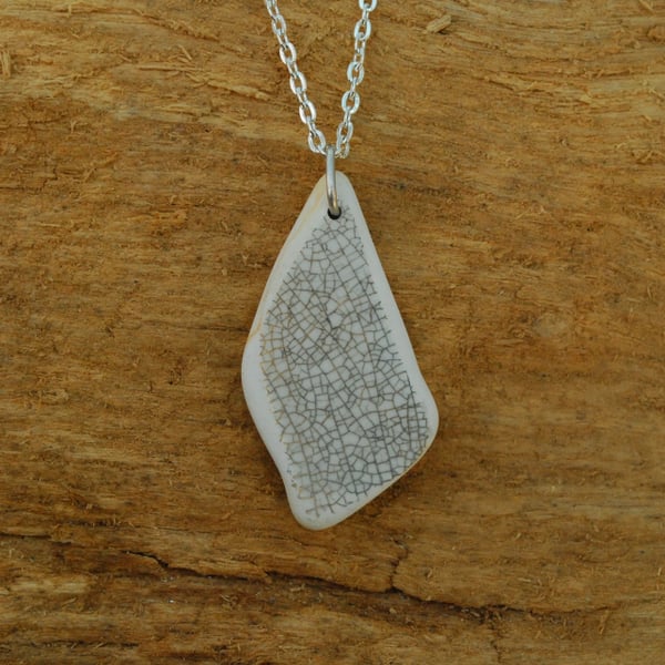 Beach pottery pendant with cracked glaze pattern