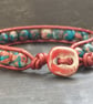 Red and blue rainbow jasper and leather bracelet with ceramic button fastener - Image 2