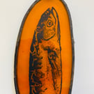 Pilchard light catcher in amber glass
