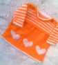 Hand Knitted Tangerine Dress with White Heart Decoration, Baby Girl's Dress - Image 1