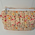 Padded floral cosmetics bag 