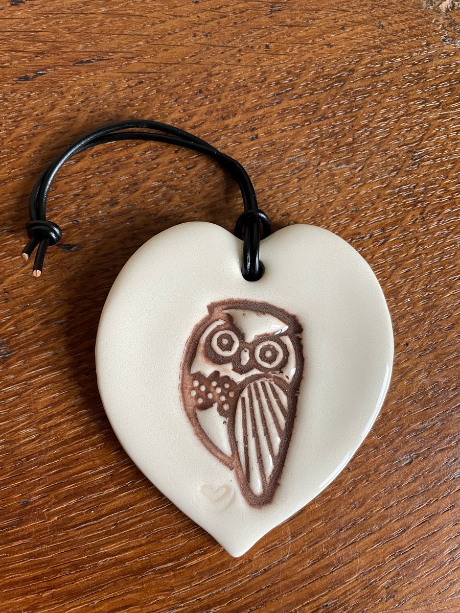 Heart-shaped ceramic owl plaque