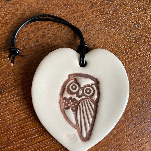 Heart-shaped ceramic owl plaque