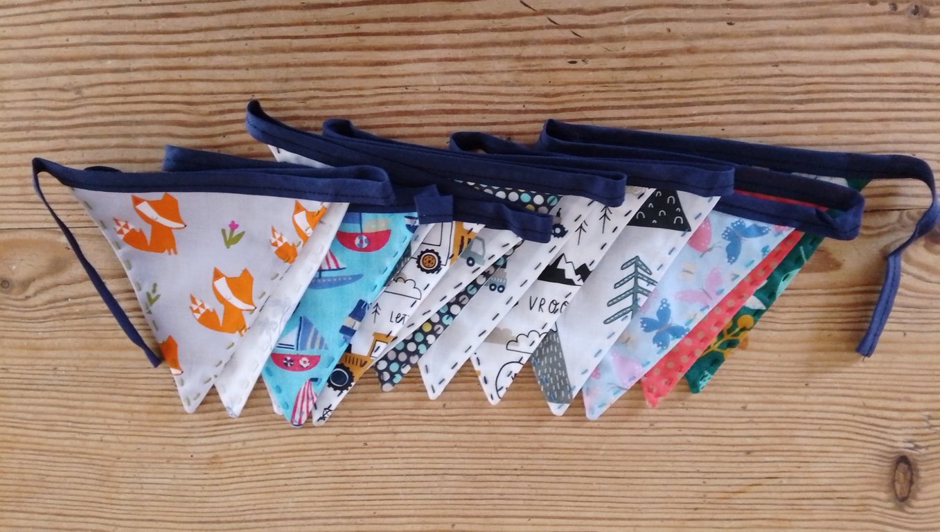 Handmade mini bunting in an animal and vehicle theme.