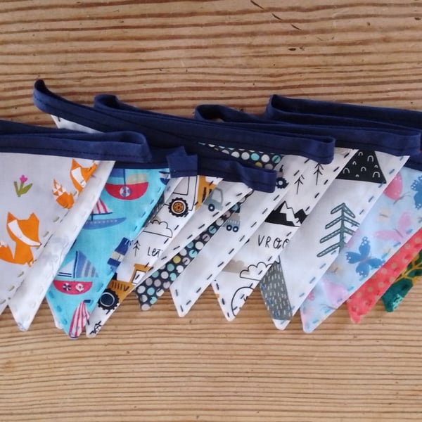 Handmade mini bunting in an animal and vehicle theme.