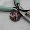 NL106 Paisley style pattern pendant on cord necklace