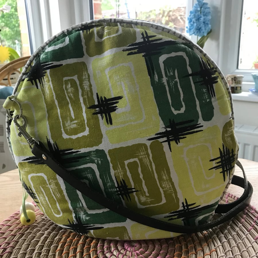 Round Zip Top Cross Body Bag in a Green Mid Century Fabric